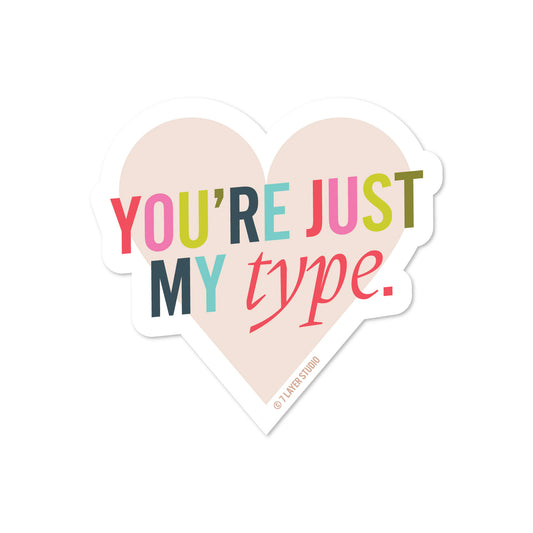 heart-shaped sticker with you're just my type written in mutlicolor letters